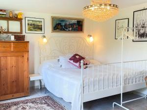 a bedroom with a crib with a teddy bear on it at 2 person holiday home in BORRBY in Borrby
