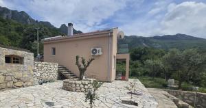 a house with a speaker on the side of it at LU House in Virpazar