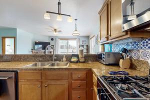 a kitchen with a sink and a stove at Truckee Living in Truckee