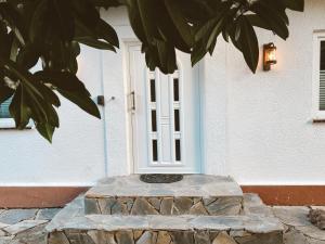 a front door of a house with a stone doorstep at EL Haus in Kassel