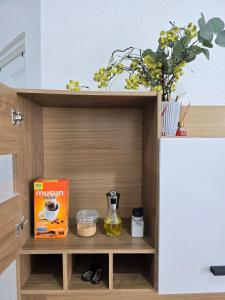 a cupboard with a box of muffins and a box of food at Tu espacio ideal in San Miguel