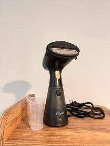 a black blender sitting on top of a wooden table at Cozy Atmosphere in the Heart of Town in Dalaman +16 photos