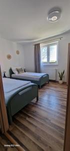 Posteľ alebo postele v izbe v ubytovaní Apartamenty Mikołajki na Kajki