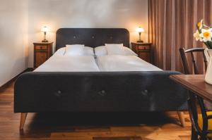 Cama o camas de una habitación en Vinařství & Vinařský dům Petratur