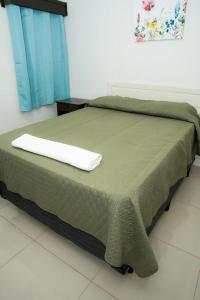 Postel nebo postele na pokoji v ubytování Hotel Centenario