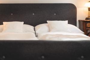 Cama o camas de una habitación en Vinařství & Vinařský dům Petratur