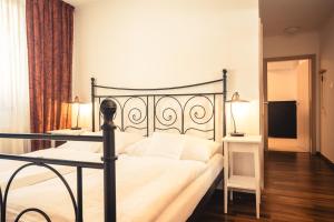 Cama o camas de una habitación en Vinařství & Vinařský dům Petratur