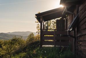a cabin with the sun shining through the door at Domek Nad Sadem in Łącko +31 photos