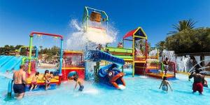 a group of people playing in a water park at Casa La Culle in Favareta