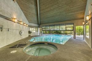 an indoor swimming pool in a building with a large room at Perch - Bellevue Retreat in Bellevue