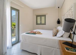 A bed or beds in a room at Blue View Villas