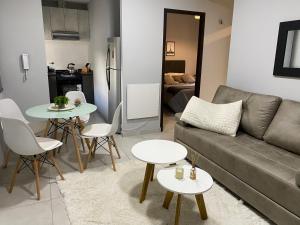a living room with a couch and a table at Micro ensueño in Godoy Cruz
