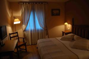 Ένα ή περισσότερα κρεβάτια σε δωμάτιο στο Hotel Areulo