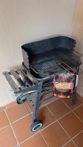 a grill sitting on top of a tile floor at Casa Azul villa e piscina relax Costa Paradiso Sardegna in Costa Paradiso +40 photos