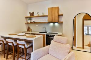 a kitchen with a sink and a table with chairs at Casa Brilla in Tivat +45 photos