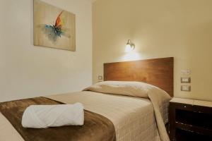 Voodi või voodid majutusasutuse Hotel Cervantino toas