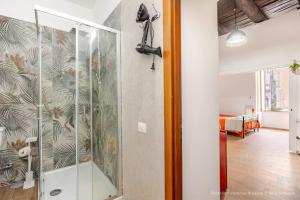 a shower in a room with a glass wall at Bernadette Boutique in Naples +70 photos