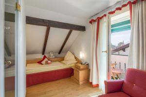 Voodi või voodid majutusasutuse Hotel Rosenvilla toas