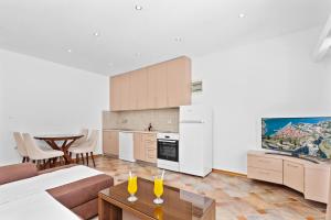 Kuchyň nebo kuchyňský kout v ubytování Apartments Dončić