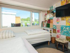 a bedroom with two beds and a window at 4 person holiday home in Aabenraa-By Traum in Aabenraa