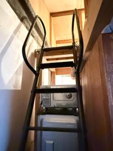 Palanda nebo palandy na pokoji v ubytování Obi House C1