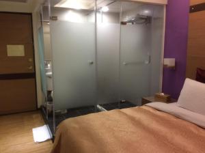 Voodi või voodid majutusasutuse 紫園旅社Purple Garden Hotel toas