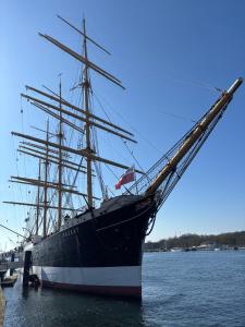 a large pirate ship docked in the water at Ferienwohnung Sonnenplatz Moba-Travel in Travemünde