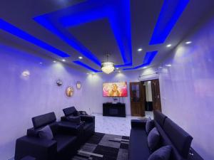 a living room with blue lights on the ceiling at Mame Thierno sene in Niakoul Rap