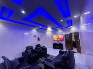 a living room with blue lights on the ceiling at Mame Thierno sene in Niakoul Rap
