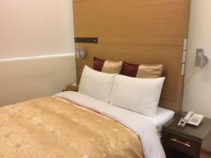 Voodi või voodid majutusasutuse 紫園旅社Purple Garden Hotel toas