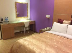 Voodi või voodid majutusasutuse 紫園旅社Purple Garden Hotel toas