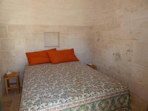 Una cama o camas en una habitación de Il Piccolo Trullo