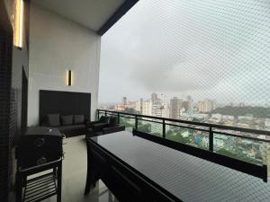 Televisyen dan/atau pusat hiburan di Apartamento Umarizal Sonata