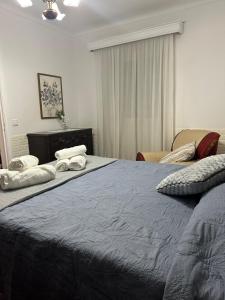 Uma cama ou camas num quarto em Island Haven - Cantinho da Ilha