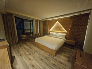Voodi või voodid majutusasutuse Neom Pyramids Valley Boutique hotel toas