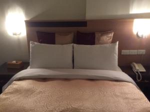 Voodi või voodid majutusasutuse 紫園旅社Purple Garden Hotel toas