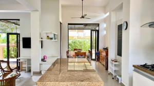 a large dining room with a large table in a room at house Boutique Casaloma Club Top Rental Properties in Girardot