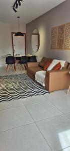 a bedroom with a bed and a dining room at Ap aconchegante a 150 mts da praia de Itapoã in Vila Velha +20 photos
