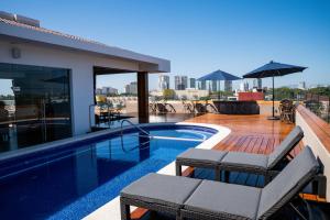 a swimming pool on the roof of a building at Vallarta Live Hotel in Puerto Vallarta
