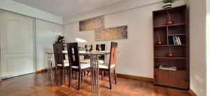 a dining room with a table and chairs at Room in shared apartment - Shared Bathroom 402 in Lima