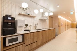 Slowon Hostel 슬로우온 호스텔 홍대 주방 또는 간이 주방