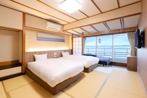 TAOYA Wakura客房内的一张或多张床位