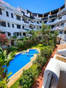 an aerial view of a building with a swimming pool at Visit Chamal - Solaya in Oued Laou