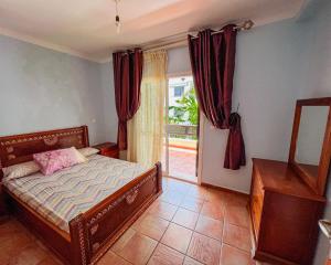 a bedroom with a bed and a window at Visit Chamal - Solaya in Oued Laou +9 photos