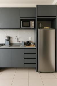 Dapur atau dapur kecil di Apartamento de Luxo com Suíte, Academia, Piscina e Mercado