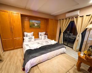 a bedroom with a large bed in a room at Atlas Front in Marrakech