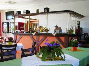 a table in a store with a mirror on the wall at Landgasthaus am Dolgensee in Reichenwalde