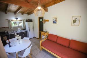 a living room with a couch and a table at Refugio del Hornero Norte in San Carlos de Bariloche +19 photos