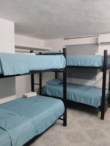 Postel nebo postele na pokoji v ubytování Casa León