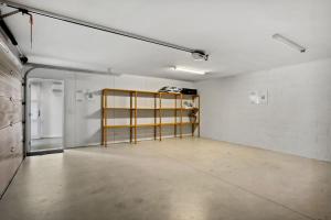 an empty room with a glass door in a building at Remarkables View Eco House in Queenstown